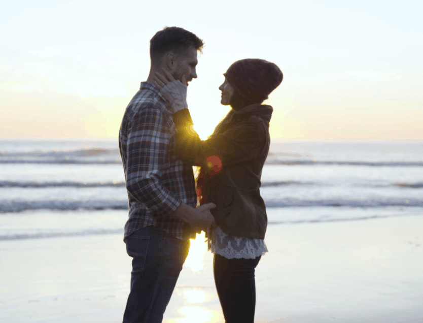 Couple looking at each other at the beach
